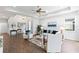 Bright living room with tray ceiling, ceiling fan, and stylish furnishings at 583 Lost Shaker Way, Daytona Beach, FL 32124