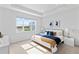 A main bedroom featuring a large window offering a view of the community lake at 583 Lost Shaker Way, Daytona Beach, FL 32124