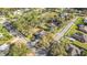 Aerial view of a property located in a leafy neighborhood with mature trees at 5981 Jandon Ct, Port Orange, FL 32127