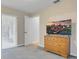 Bedroom featuring neutral walls, carpet, and a dresser for storage at 5981 Jandon Ct, Port Orange, FL 32127