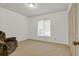 Bedroom features a large window, neutral walls, carpeting and closet at 5981 Jandon Ct, Port Orange, FL 32127