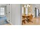 Dining room boasts wood flooring, a round table, and a chandelier above at 5981 Jandon Ct, Port Orange, FL 32127