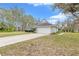 View of the home featuring the driveway and a two-car garage at 5981 Jandon Ct, Port Orange, FL 32127