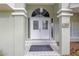 Elegant front entryway featuring double doors, decorative glass, and tiled steps at 5981 Jandon Ct, Port Orange, FL 32127