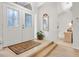 Welcoming foyer with double doors, glass inserts, and views into the home at 5981 Jandon Ct, Port Orange, FL 32127