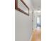 Hallway features hardwood floors, base trim, and a decorative mirror at 5981 Jandon Ct, Port Orange, FL 32127