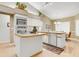 Charming kitchen with an island, stainless steel appliances, and decor at 5981 Jandon Ct, Port Orange, FL 32127