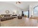 Bright and airy living room with hardwood floors and neutral decor at 5981 Jandon Ct, Port Orange, FL 32127