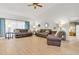 Spacious living room with hardwood floors, couches, and natural light at 5981 Jandon Ct, Port Orange, FL 32127