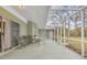 Enclosed patio with outdoor dining area, chairs, and a view to the backyard at 5981 Jandon Ct, Port Orange, FL 32127