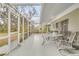 Spacious enclosed patio with dining area and views of the lush backyard at 5981 Jandon Ct, Port Orange, FL 32127