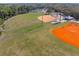 An aerial view of the recreation area with a ball field, tennis court, and a playground at 6058 Central Park Blvd, Port Orange, FL 32127