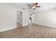 Bright bedroom with a ceiling fan and durable, wood-look flooring at 6058 Central Park Blvd, Port Orange, FL 32127