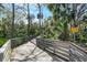 Picturesque wooded boardwalk area with sign, 'Caution Slippery When Wet' at 6058 Central Park Blvd, Port Orange, FL 32127