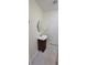 Bathroom featuring a pedestal sink, oval mirror and tiled floor at 685 E French Ave, Orange City, FL 32763