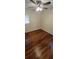 Bedroom with hardwood floors, ceiling fan, and window at 685 E French Ave, Orange City, FL 32763