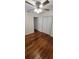 Bedroom with hardwood floors, ceiling fan, and closet at 685 E French Ave, Orange City, FL 32763