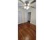 Cozy bedroom featuring hardwood floors, a ceiling fan, and a closet at 685 E French Ave, Orange City, FL 32763