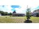 Charming single-story home featuring a spacious yard, creating a welcoming outdoor space at 685 E French Ave, Orange City, FL 32763
