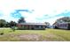 Charming single story home on a corner lot with a spacious lawn and screened porch area at 685 E French Ave, Orange City, FL 32763