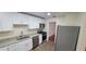 Modern kitchen with stainless steel appliances and a sleek design at 685 E French Ave, Orange City, FL 32763