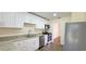 Beautiful kitchen features white cabinets, stainless steel appliances, and ample counter space at 685 E French Ave, Orange City, FL 32763