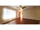 Bright living room featuring hardwood floors, natural light, and a cozy atmosphere at 685 E French Ave, Orange City, FL 32763