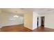 Bright living room boasts hardwood floors and a front door, complemented by natural light from the window at 685 E French Ave, Orange City, FL 32763