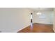 Bright living room featuring hardwood floors and natural light through the window at 685 E French Ave, Orange City, FL 32763
