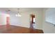 Open living space with hardwood floors and access to the front entrance at 685 E French Ave, Orange City, FL 32763
