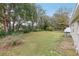 The property features a spacious backyard with mature trees, perfect for outdoor activities and enjoying nature's tranquility at 722 Valencia Ave, Orange City, FL 32763