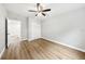 Bedroom featuring wood-look floors, a ceiling fan, and a closet at 722 Valencia Ave, Orange City, FL 32763