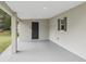 Covered carport featuring fresh paint and easy access to the home's side entrance at 722 Valencia Ave, Orange City, FL 32763