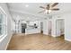 Modern kitchen with white cabinets, stainless steel appliances, and an island countertop at 722 Valencia Ave, Orange City, FL 32763