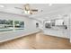 Inviting living room with hardwood floors and an open layout into the kitchen at 722 Valencia Ave, Orange City, FL 32763