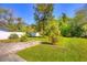 Lush backyard featuring mature trees and ample green space at 741 Greenway Pl, Daytona Beach, FL 32114