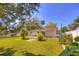 Large backyard with lush lawn and minimal landscaping at 741 Greenway Pl, Daytona Beach, FL 32114