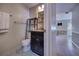 Bathroom featuring a vanity with granite countertop and an open shelving unit for storage at 741 Greenway Pl, Daytona Beach, FL 32114