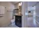Cozy bathroom features a dark wood vanity and shelving unit at 741 Greenway Pl, Daytona Beach, FL 32114