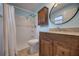 Bathroom featuring a walk-in shower and a wood vanity with a granite countertop at 741 Greenway Pl, Daytona Beach, FL 32114
