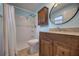 Charming bathroom with walk-in shower and wood vanity at 741 Greenway Pl, Daytona Beach, FL 32114