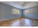 Bright bedroom with a ceiling fan and two windows providing natural light at 741 Greenway Pl, Daytona Beach, FL 32114