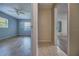 View between 2 rooms, showing a bedroom with ceiling fan, and a 2nd room with ceiling fan at 741 Greenway Pl, Daytona Beach, FL 32114