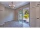 Bright dining area with sliding glass doors to the patio and built-in cabinets at 741 Greenway Pl, Daytona Beach, FL 32114