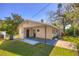 Charming home exterior featuring a covered carport and well-maintained lawn at 741 Greenway Pl, Daytona Beach, FL 32114