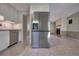 Modern stainless steel refrigerator and spacious tiled kitchen area at 741 Greenway Pl, Daytona Beach, FL 32114