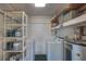 Laundry room with shelving for storage and laundry appliances at 741 Greenway Pl, Daytona Beach, FL 32114