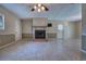 Bright living room features a decorative fireplace, neutral color scheme, and tiled floors at 741 Greenway Pl, Daytona Beach, FL 32114
