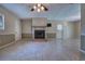 Open living room with tile floors and a cozy fireplace at 741 Greenway Pl, Daytona Beach, FL 32114