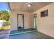 Covered patio with access to the laundry room and the interior of the house at 741 Greenway Pl, Daytona Beach, FL 32114